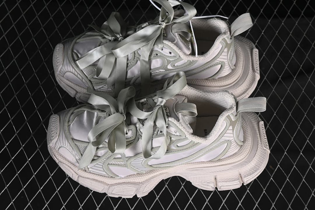 Pair of taupe 3XL sneakers shown from the side