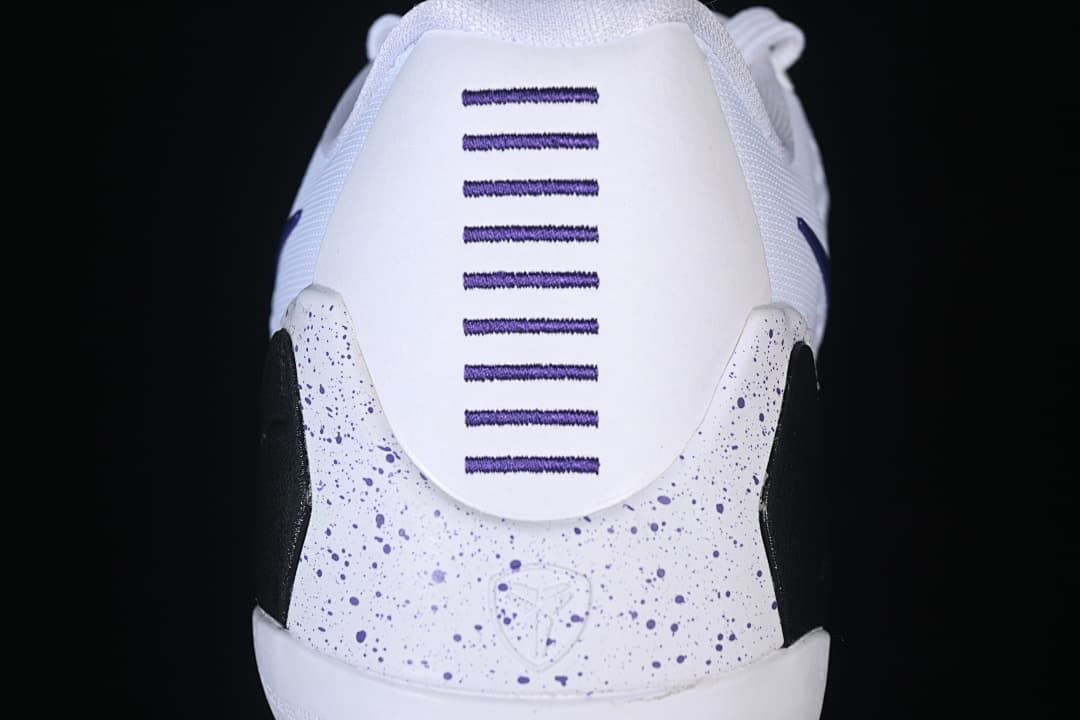 Rear view showing purple heel stitching and speckled black-and-purple details
