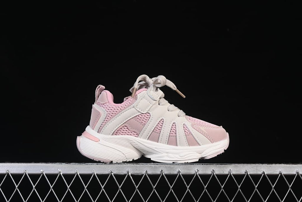 Side profile of a pink and off-white adidas kids sneaker