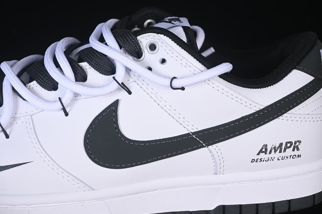 Side detail of the black Swoosh, layered laces, and heel graphic