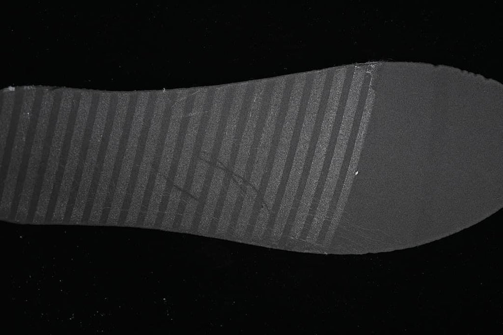 Close-up of the black outsole tread