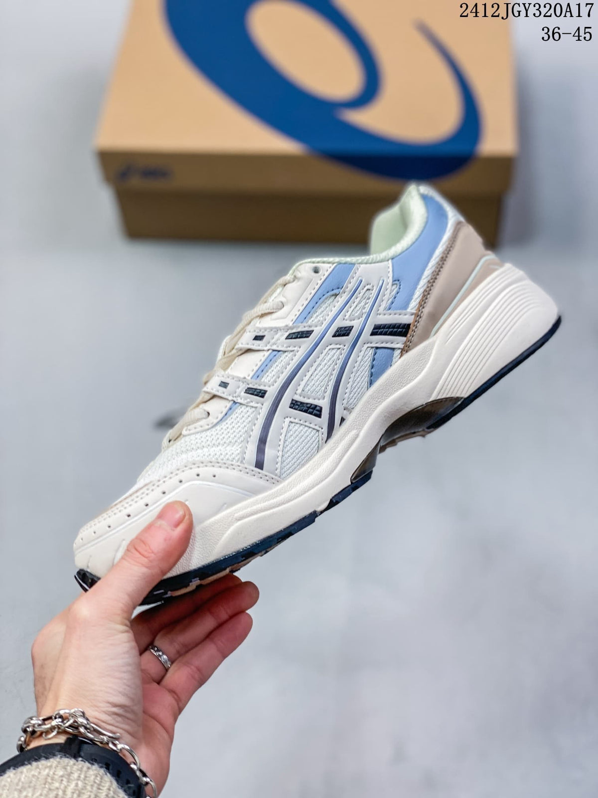 Side view of a white ASICS GEL-1090 sneaker with light blue and navy accents; image shows size range 36–45.