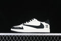 Side profile of a black-and-white low-top sneaker against a dark background.