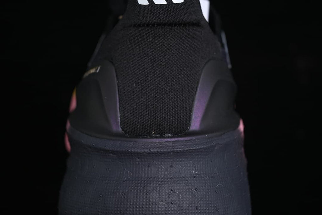 Rear view showing the black heel, heel support, and dark midsole.