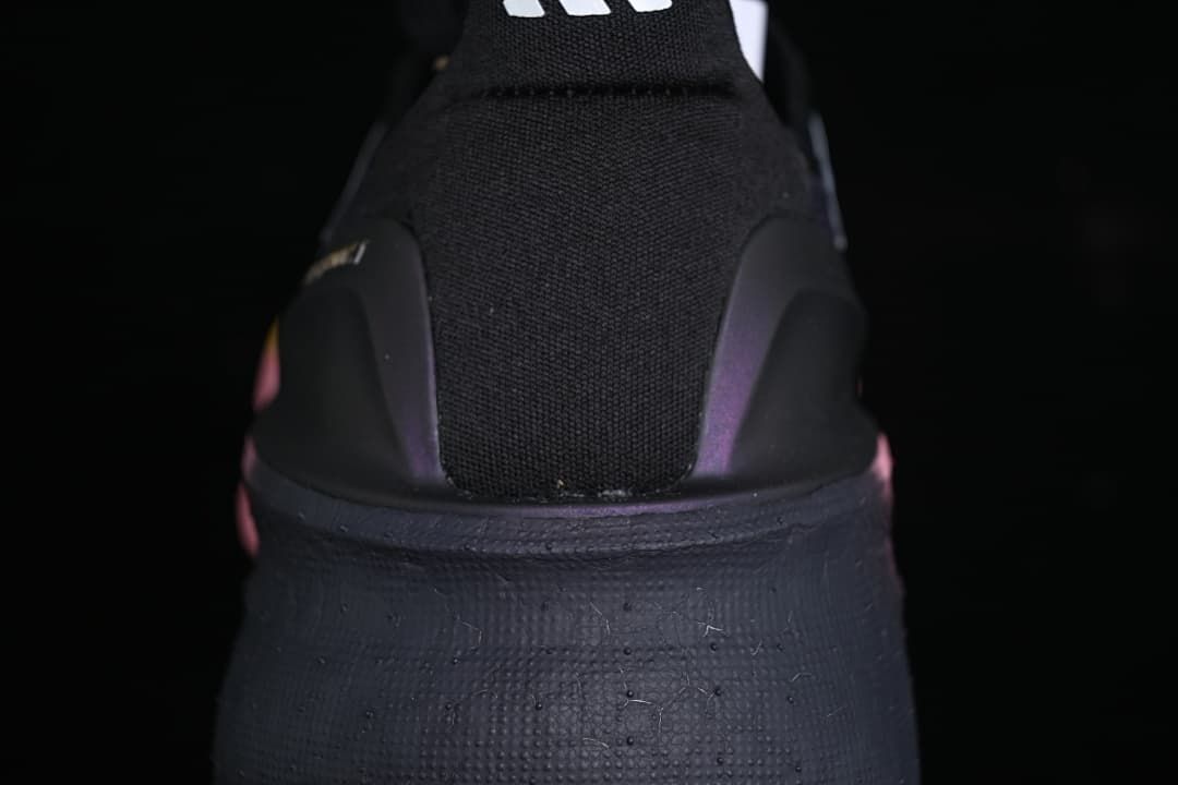 Rear view showing the black heel, heel support, and dark midsole.
