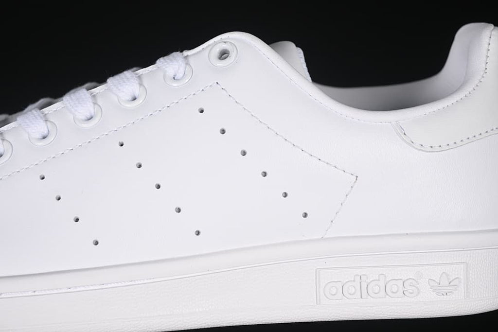 Close-up of perforated side detailing and tonal sole branding