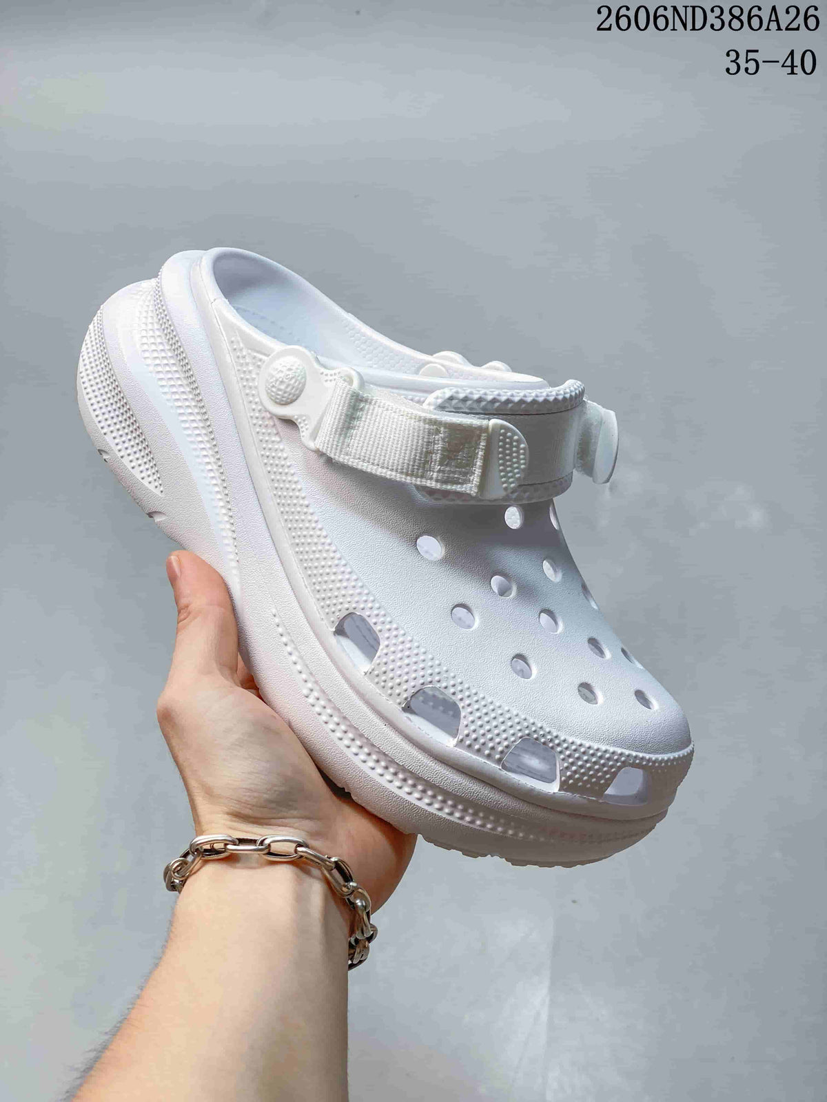 White perforated clog sandal with thick textured sole and adjustable heel strap