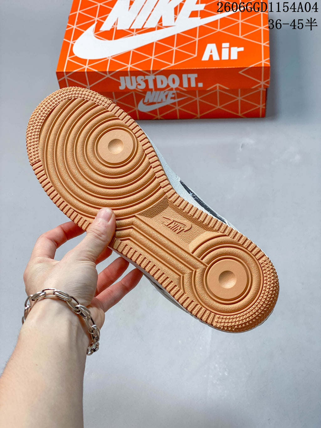 Close-up of the gum-colored outsole with concentric tread patterns.