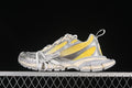 Pair of yellow, off-white, and gray Balenciaga 3XL sneakers shown from the side