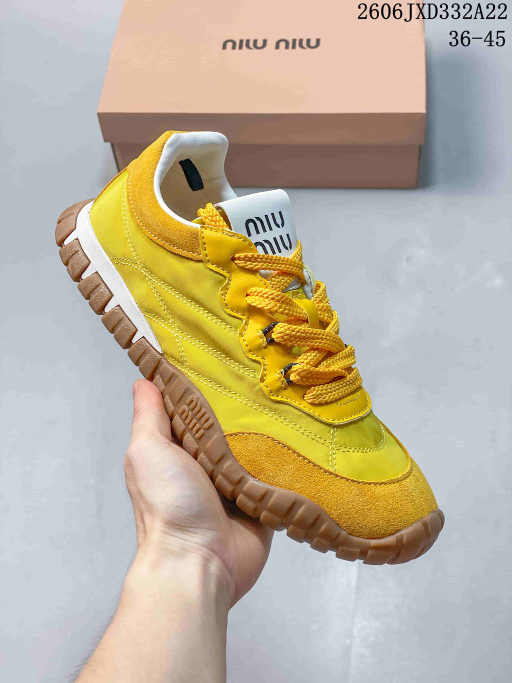 Angled side view of the yellow sneaker with its lugged outsole