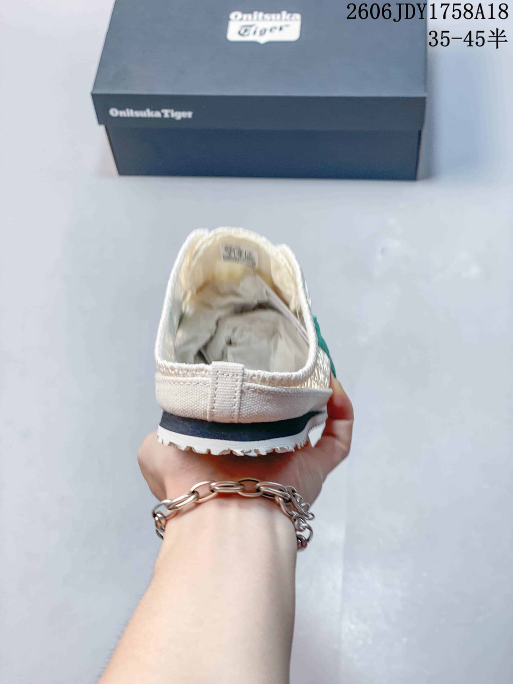 Rear view showing the open-back design of a cream Onitsuka Tiger Sabot shoe