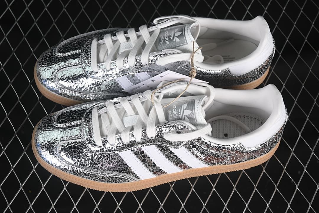 Pair of silver patterned Samba OG sneakers with white details and gum-colored soles