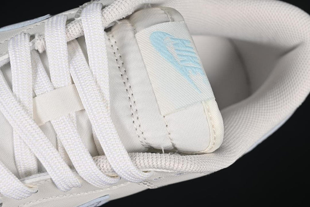 Close-up of white laces, tongue label and padded collar