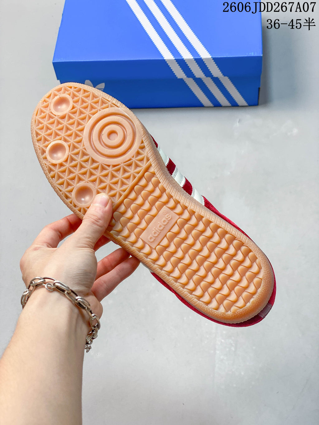 Close-up of the sneaker’s gum-colored outsole with patterned tread.