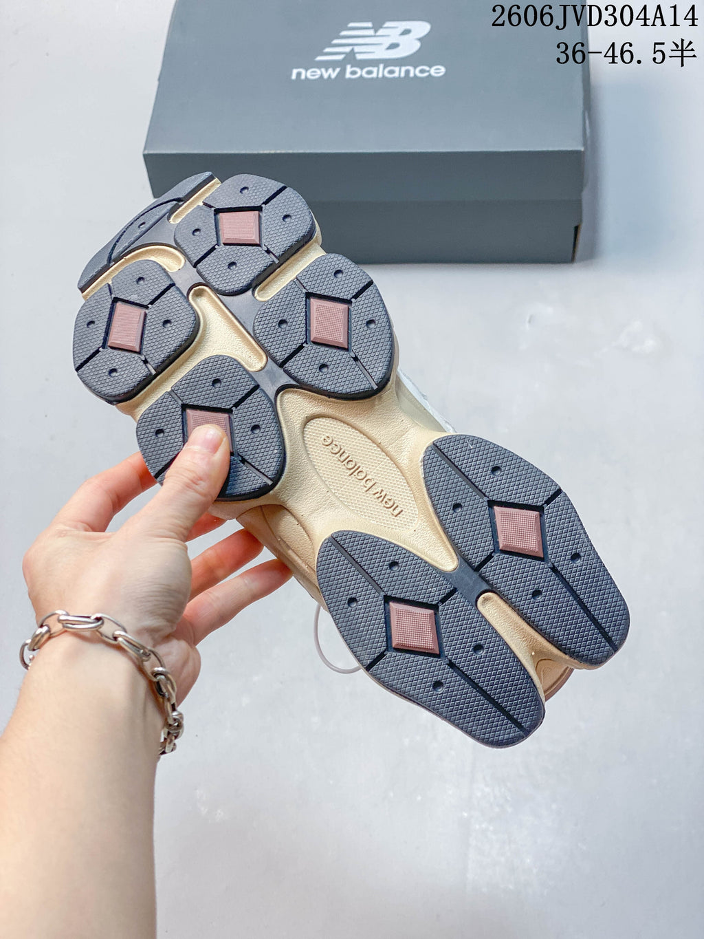 Underside of a New Balance 9060 sneaker showing the segmented outsole