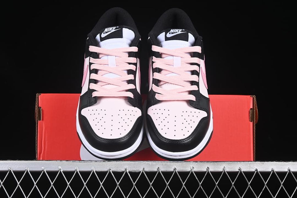 Front view of both sneakers resting on the shoe box