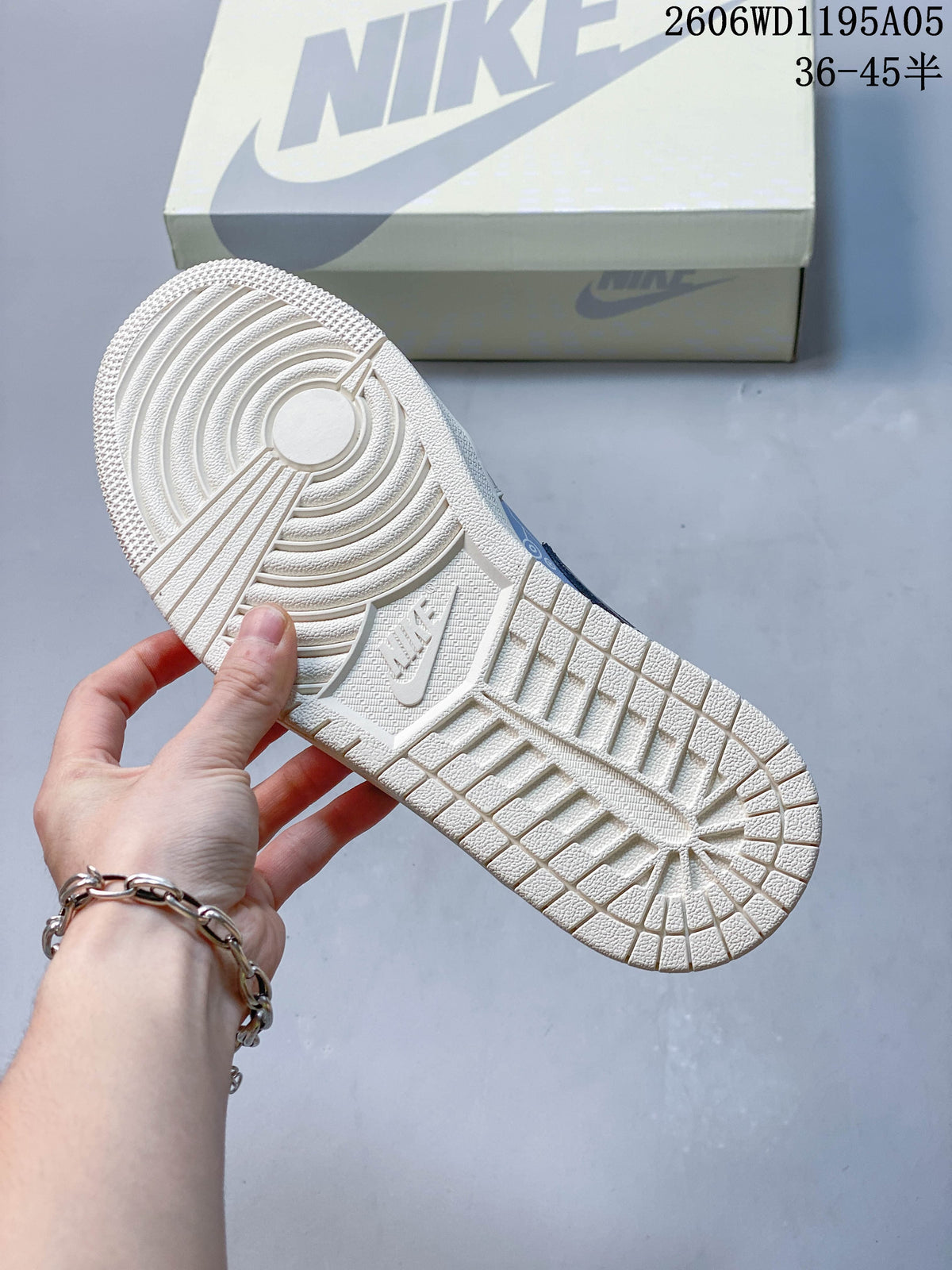 Textured outsole of a white sneaker shown beside a shoe box