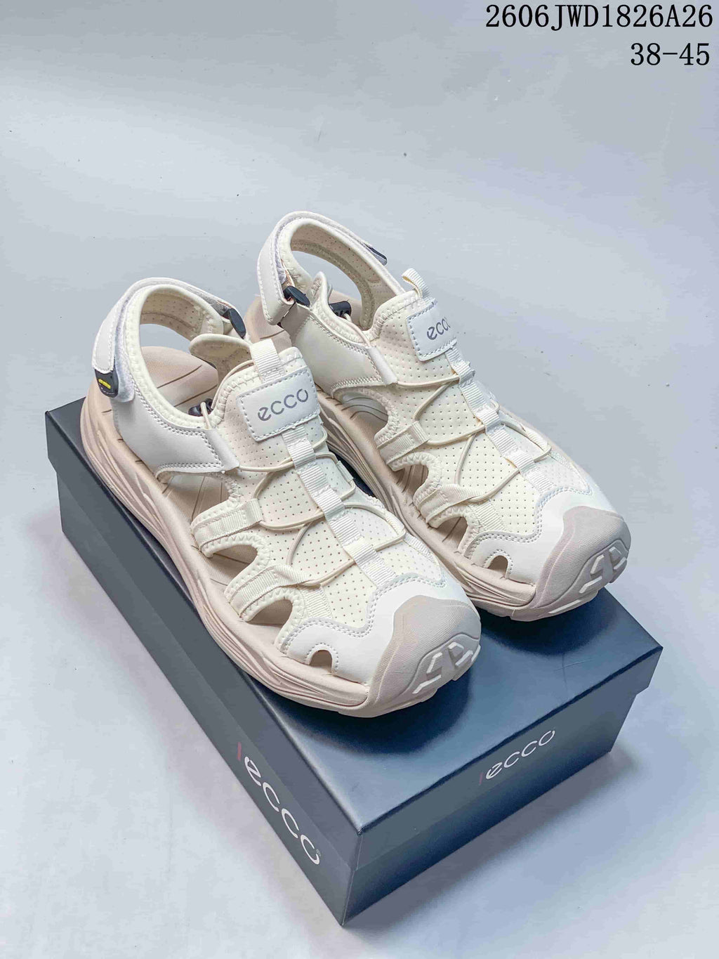 Pair of white ECCO open-toe sandals with perforated panels and cutout sides.