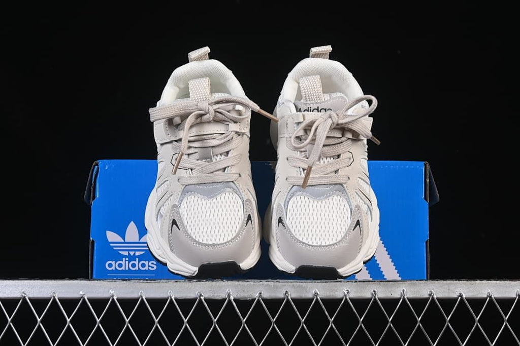 Front view of the pair displayed on a blue shoe box