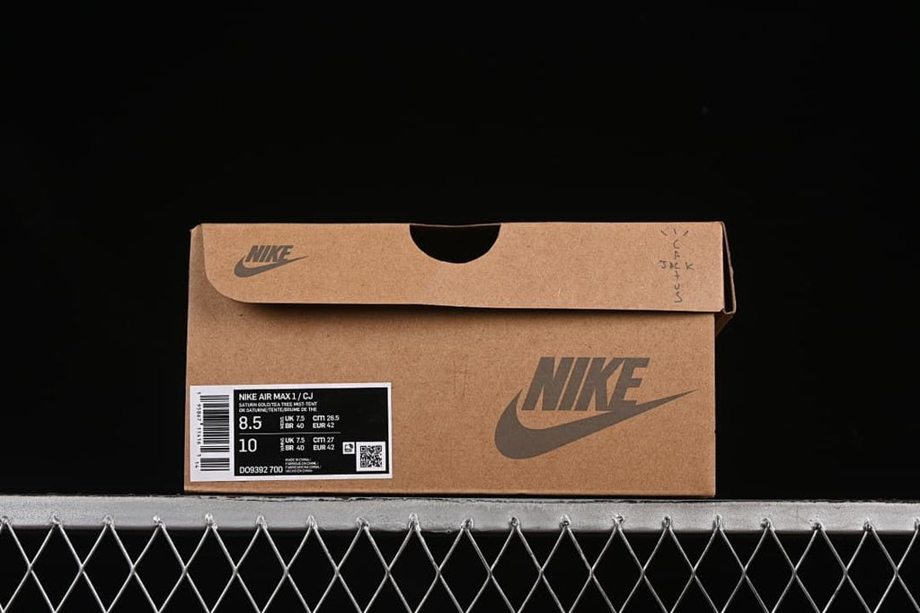 Nike shoe box label displaying the Air Max 1 name, size information, and style code DO9392-700.