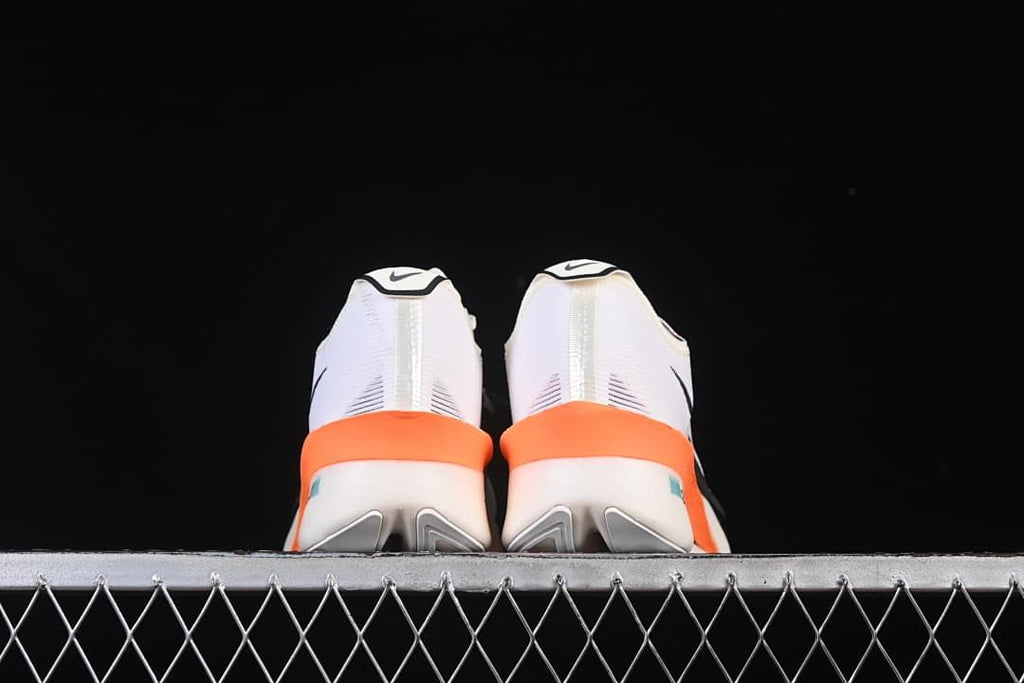 Rear view of the pair showing orange heel accents and sculpted soles