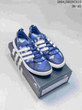 Pair of blue and gray adidas Terrex CC Boat water shoes with white side stripes