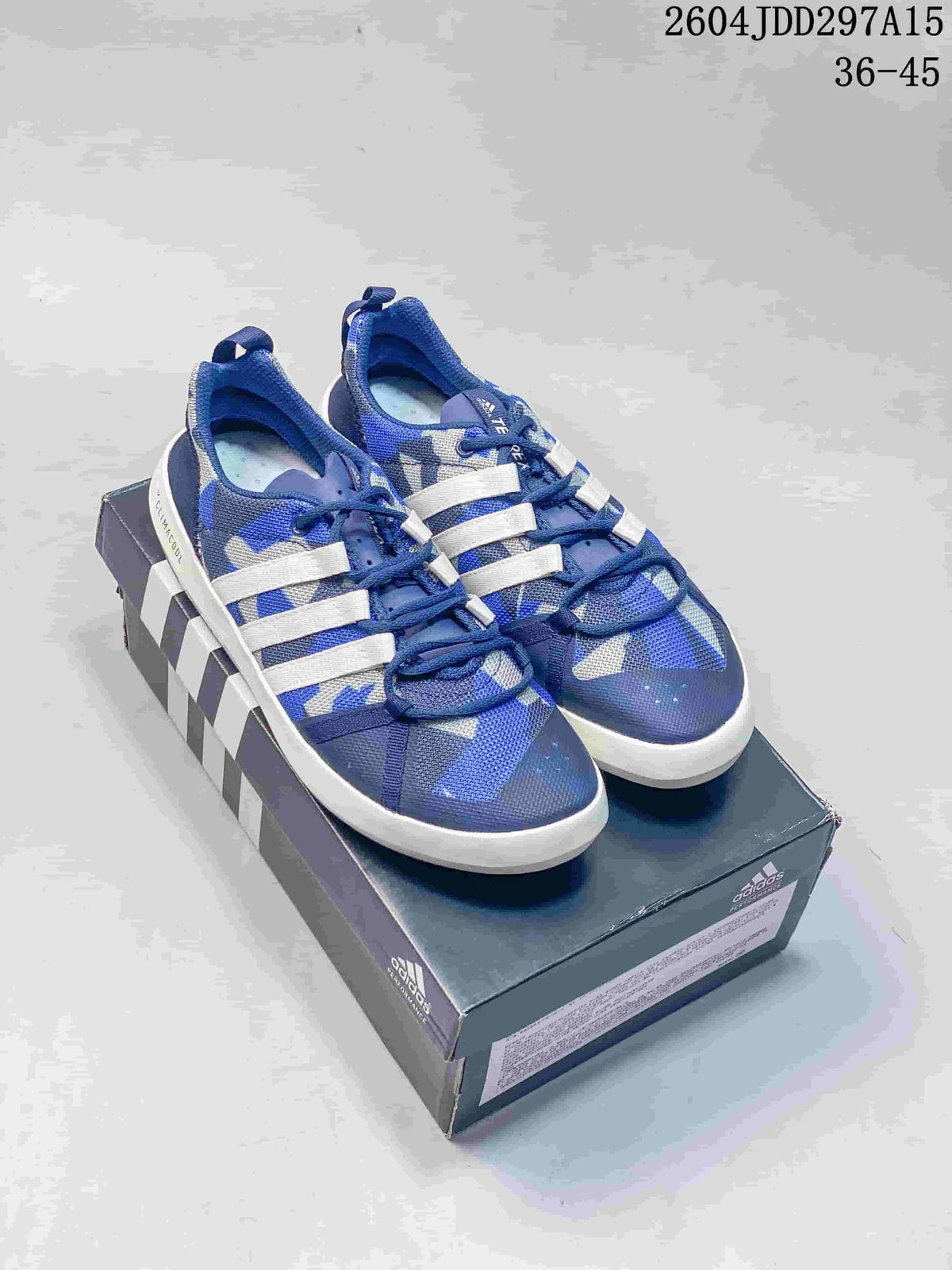 Pair of blue and gray adidas Terrex CC Boat water shoes with white side stripes