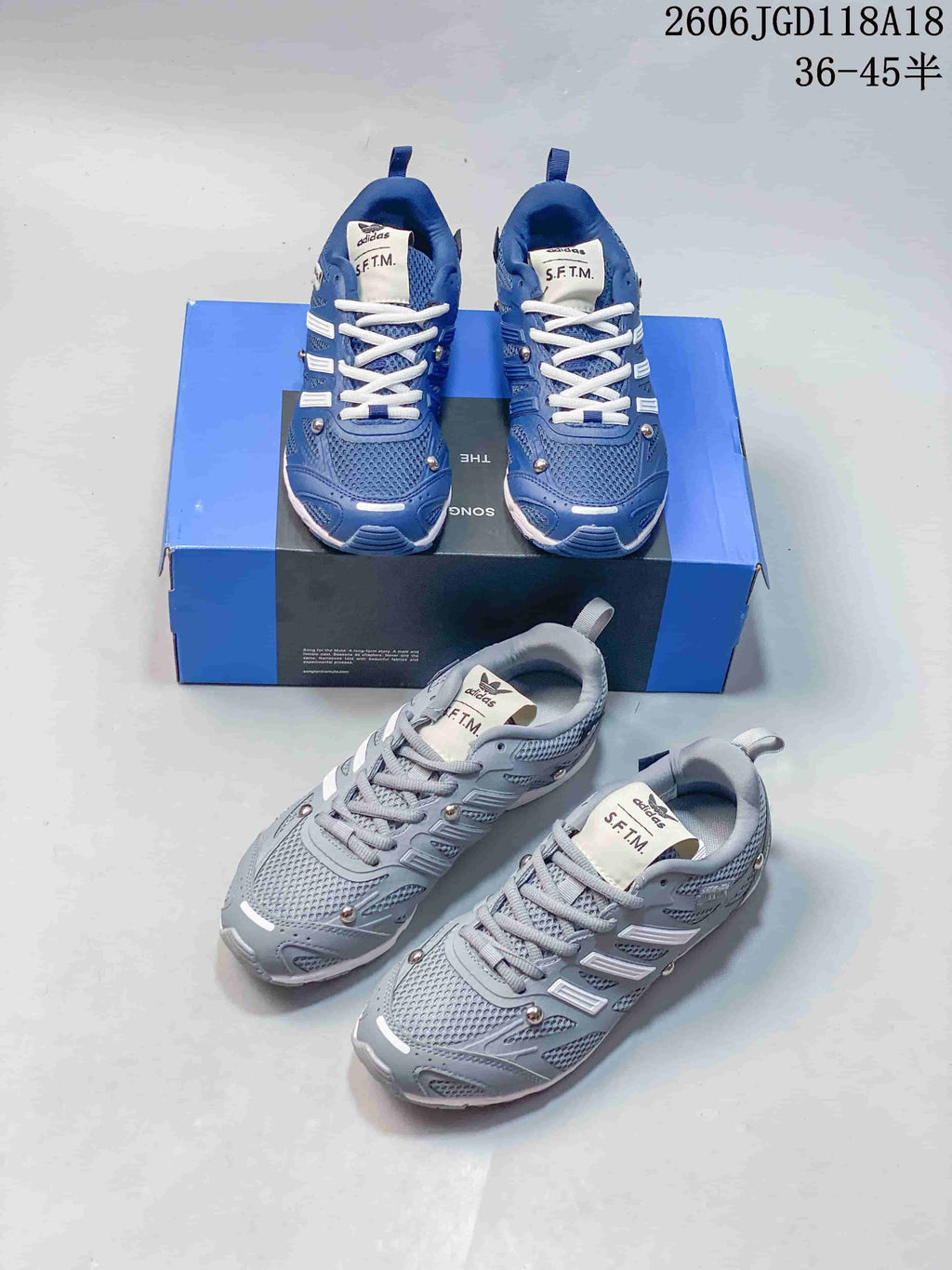 Blue and light grey adidas Adizero PR SFTM sneakers shown with their presentation box