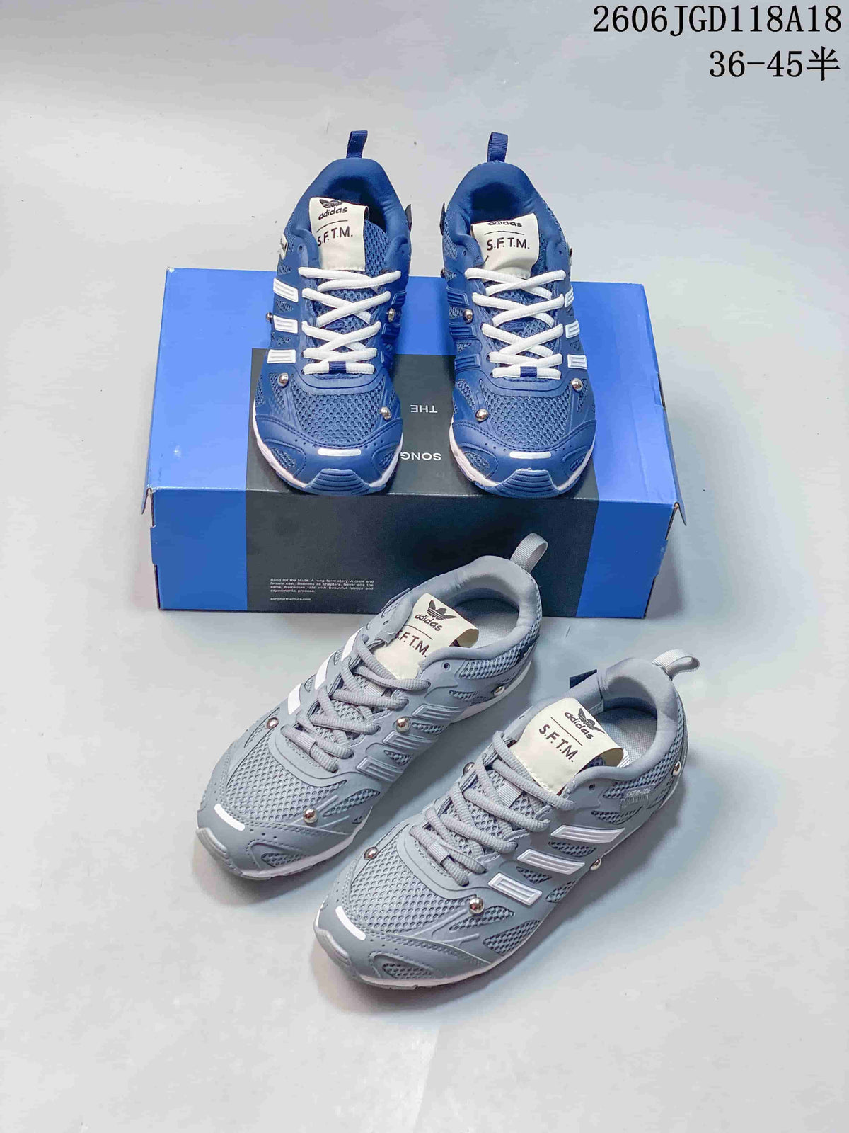 Blue and light grey adidas Adizero PR SFTM sneakers shown with their presentation box