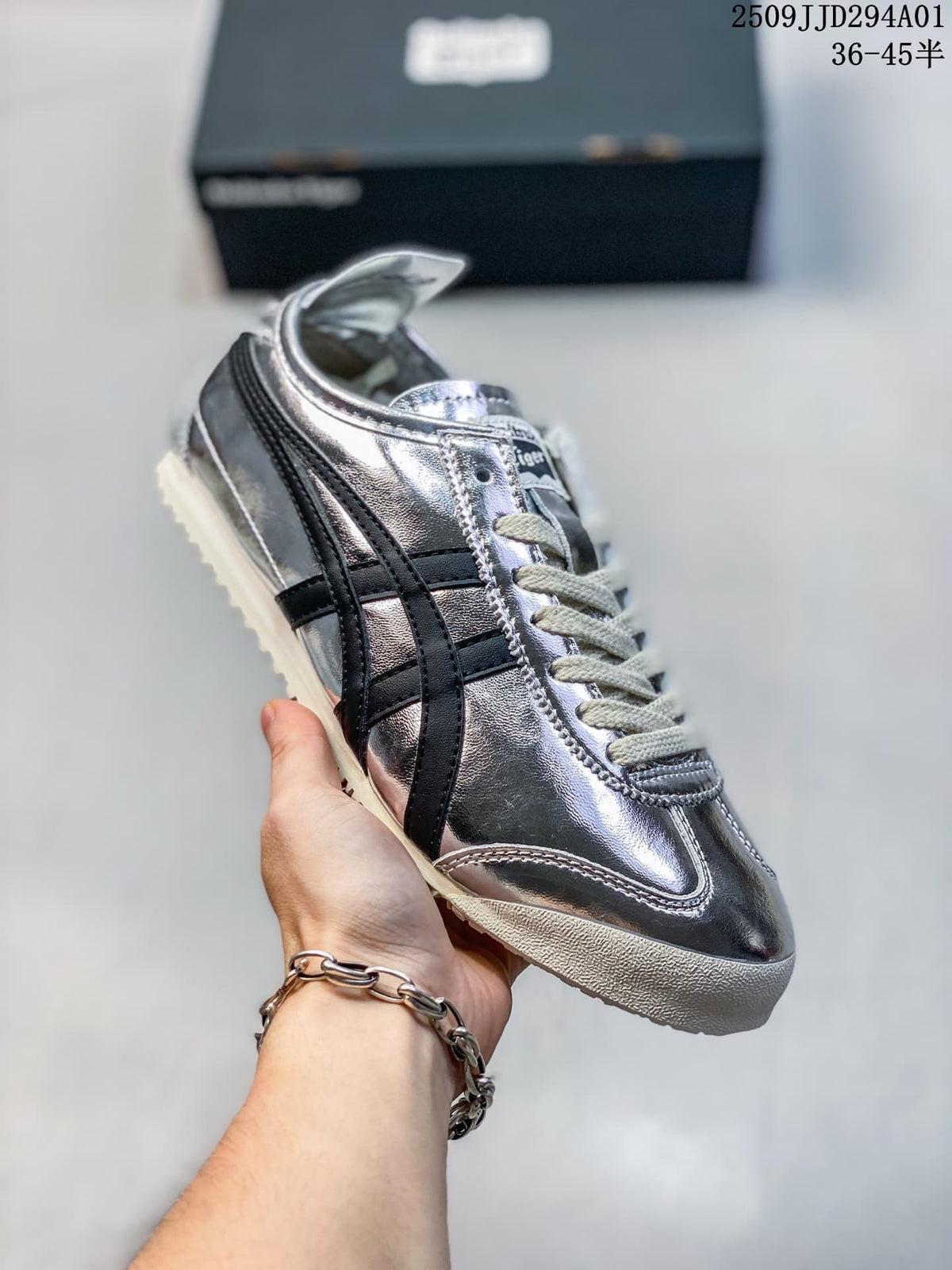 Silver metallic low-top sneaker with black side stripes and a light textured outsole; size range text appears in the image.