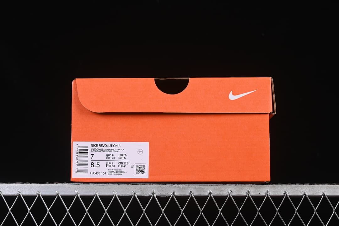 Orange shoe box with label identifying Nike Revolution 8 and model HJ8485-104