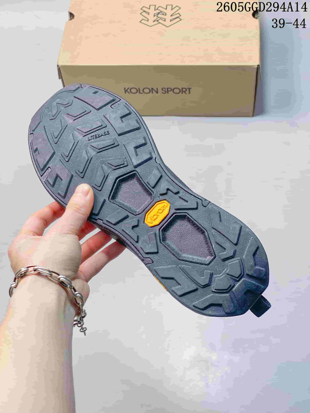 Close-up of the lugged outsole and tread pattern