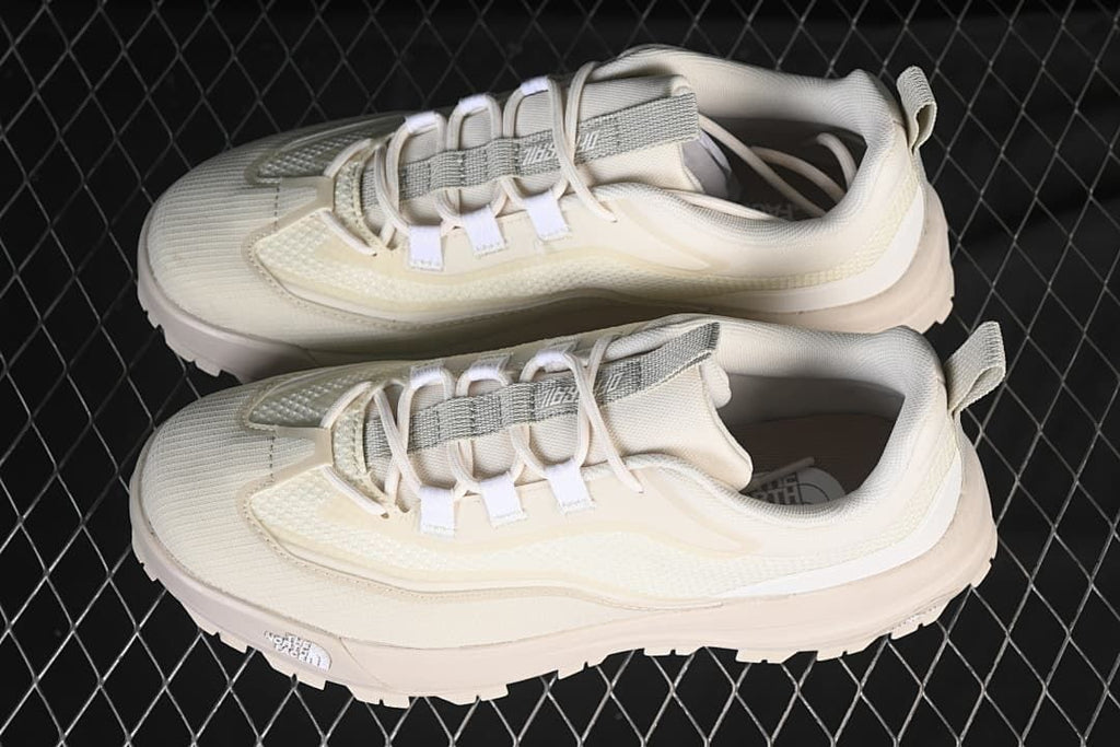 Pair of light-colored Offtrail V E shoes shown from above at an angle