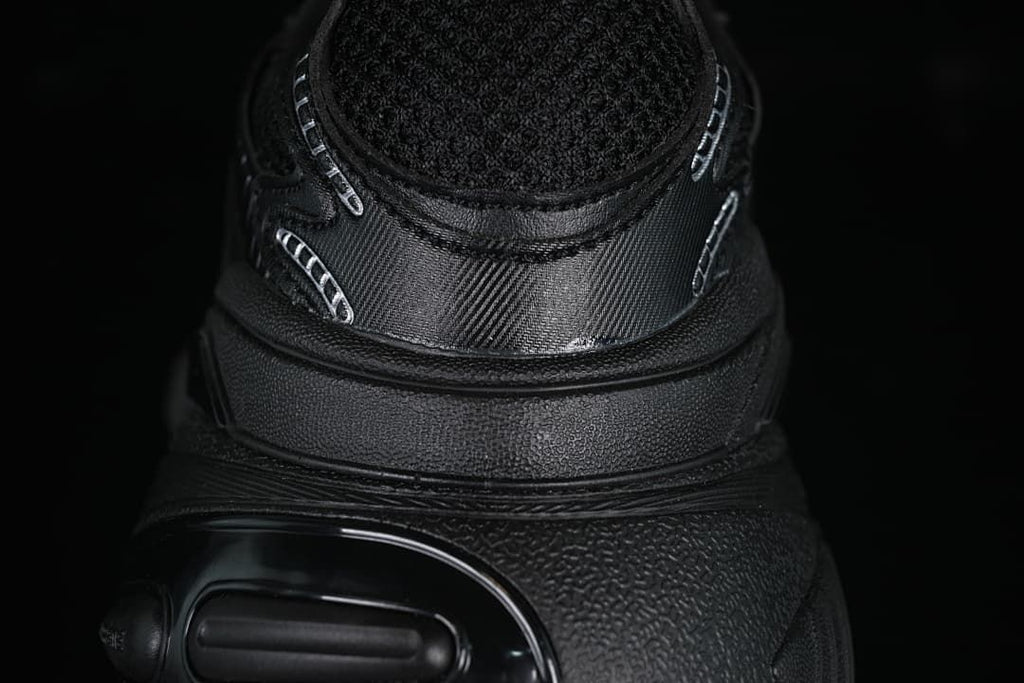 Close-up of the black heel and sculpted sole