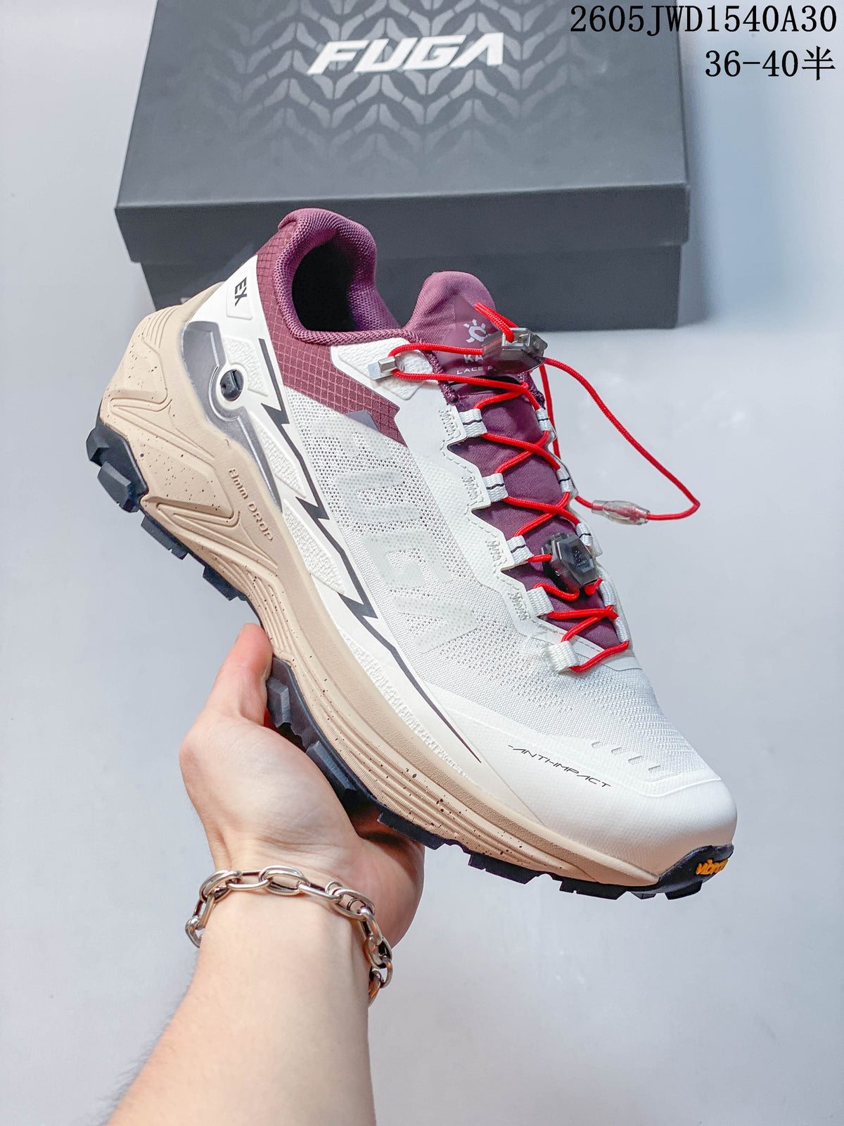 White and gray Kailas FUGA low-top shoe with orange laces, blue accents, and a lugged outsole.