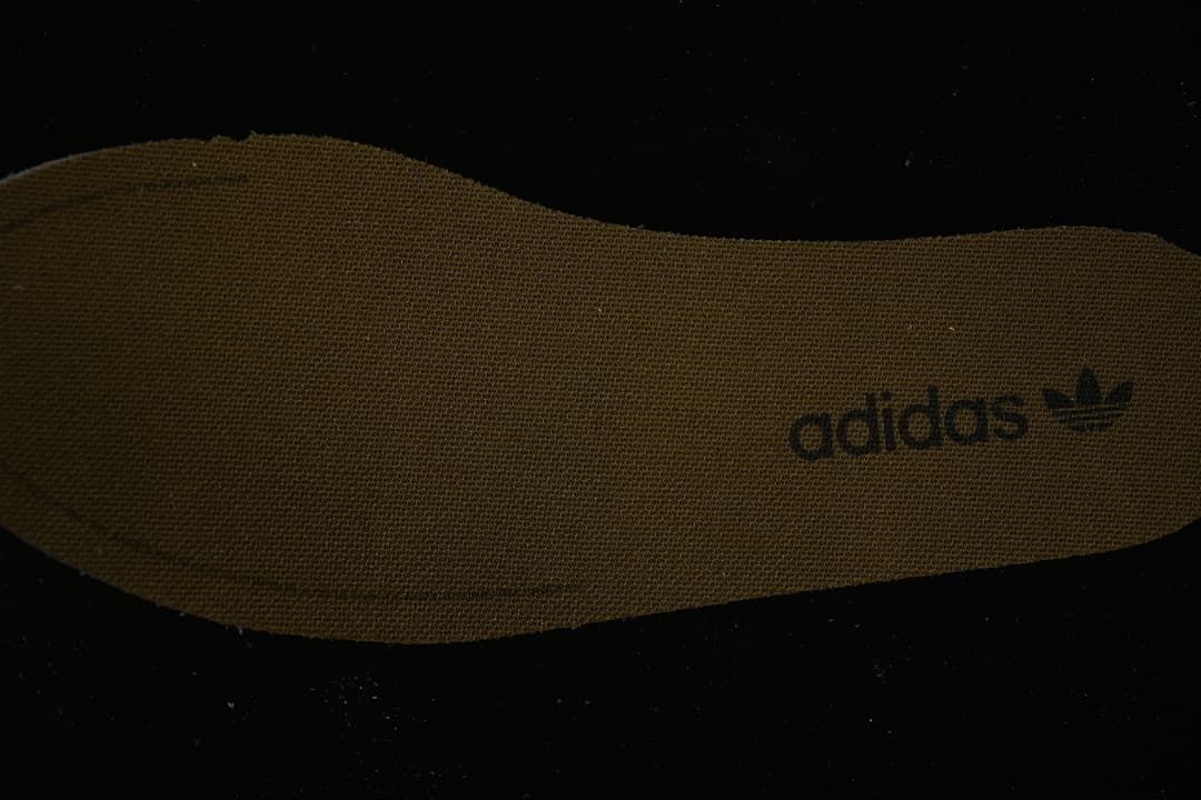 Close-up of the brown insole with adidas branding