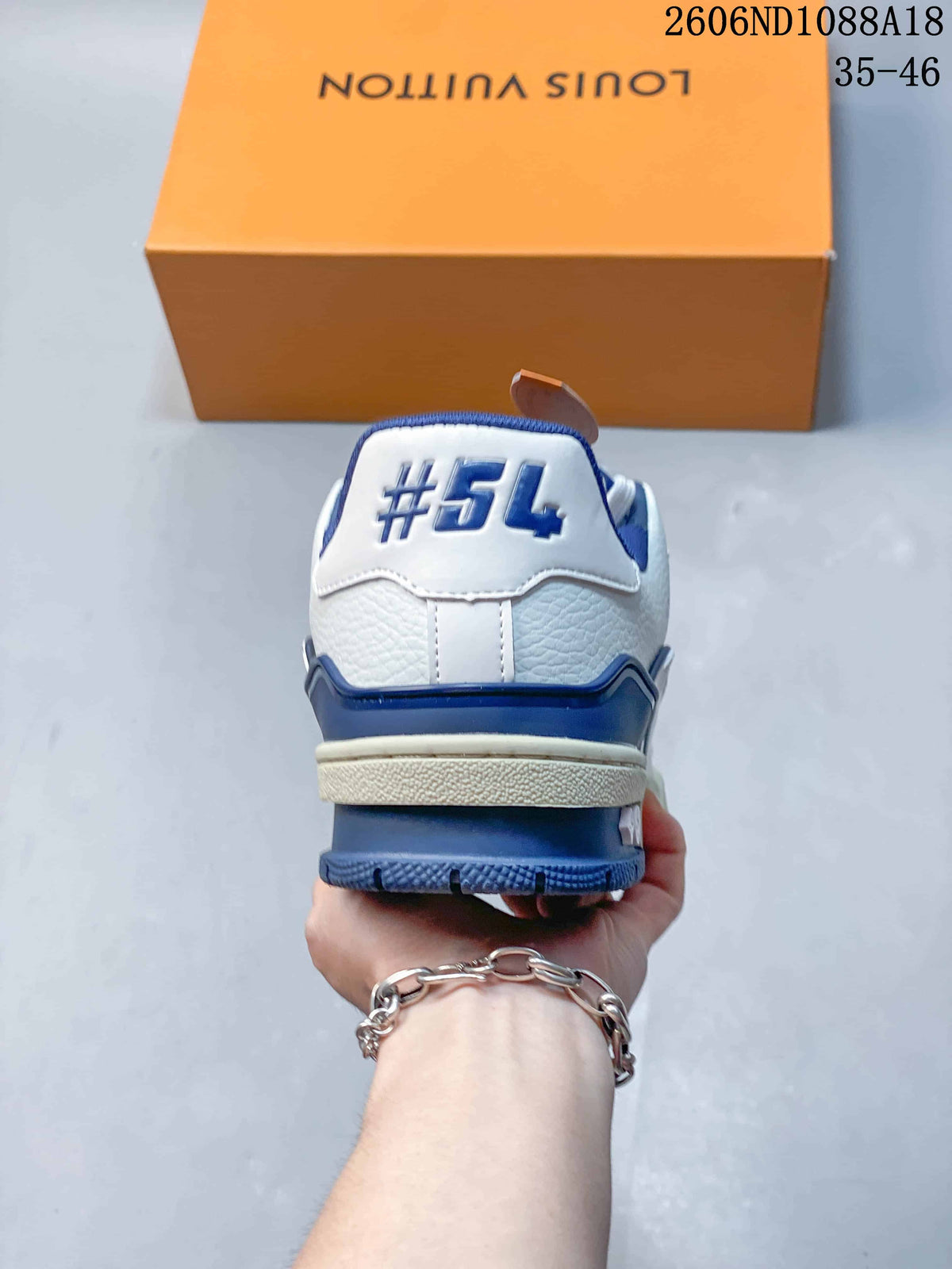 Rear view showing the heel panel and blue outsole accents