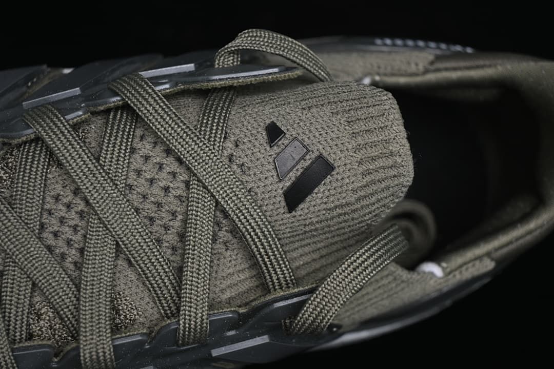Close-up of the tongue, laces, and adidas logo