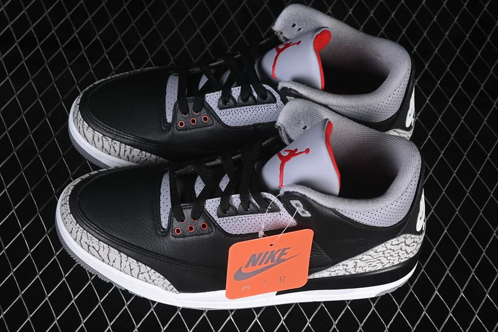 Pair of Air Jordan 3 sneakers showing black, grey and red details