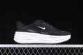 Side view of a black Nike Comfort Ride Easyon shoe with white Swoosh and thick white midsole.