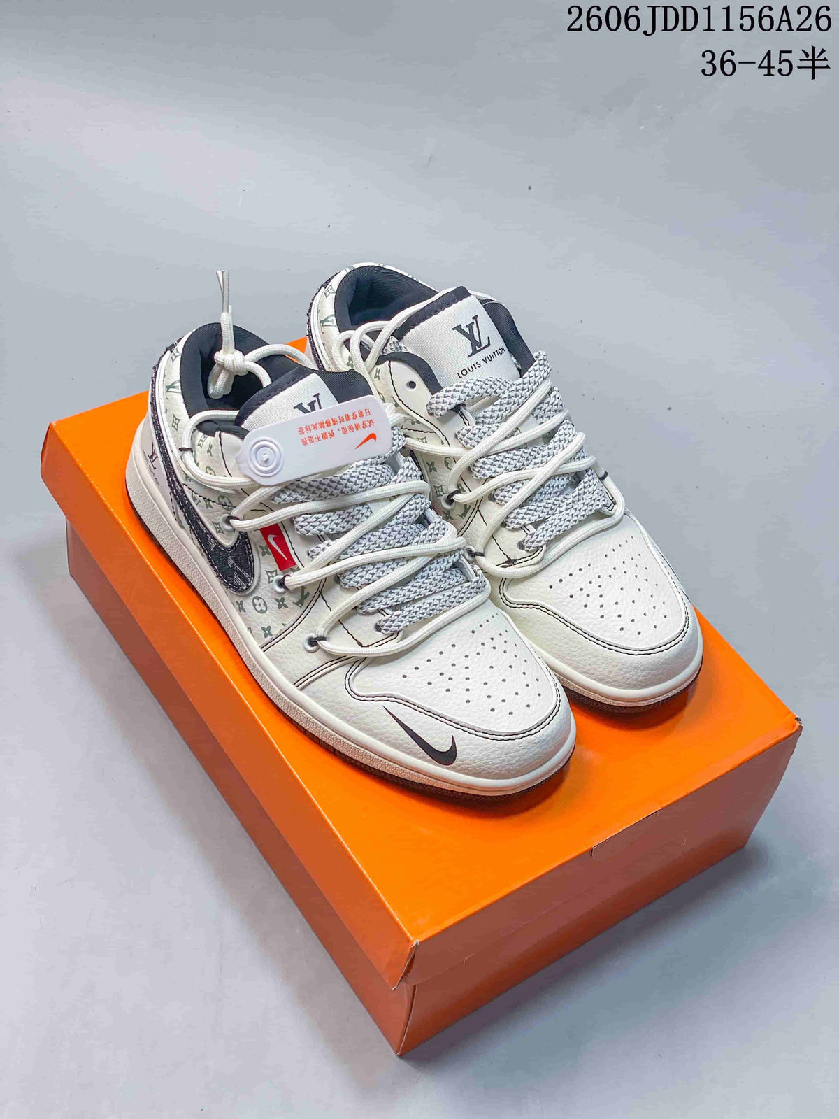 Pair of white low-top sneakers with printed pattern panels and dark accents.