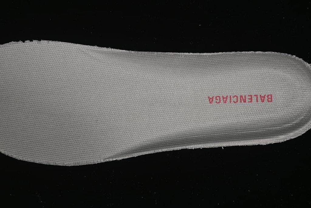 Close-up of the textured insole with a red brand wordmark.