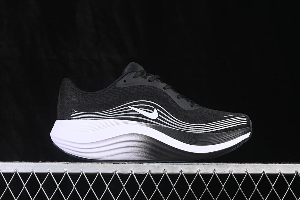Side view of the black Nike Journey Run shoe with white side detailing