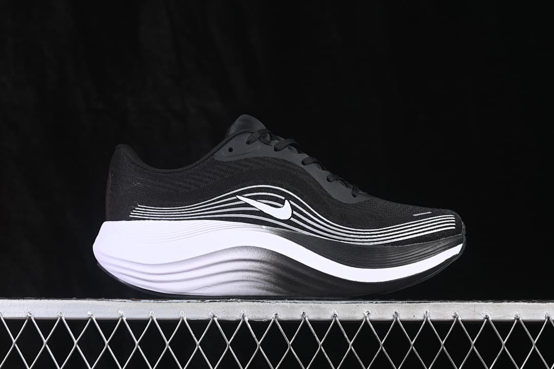 Side view of the black Nike Journey Run shoe with white side detailing