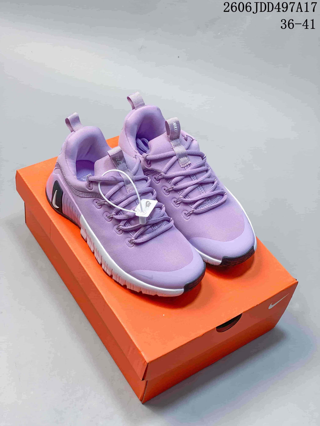 Lavender Nike Free Metcon 7 training shoes on an orange shoebox; image overlay shows size range 36–41.