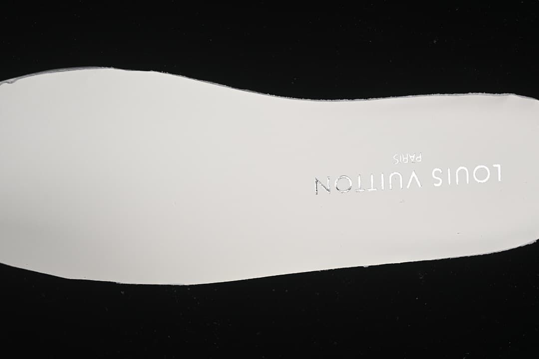 View of the pale insole with Louis Vuitton Paris lettering.
