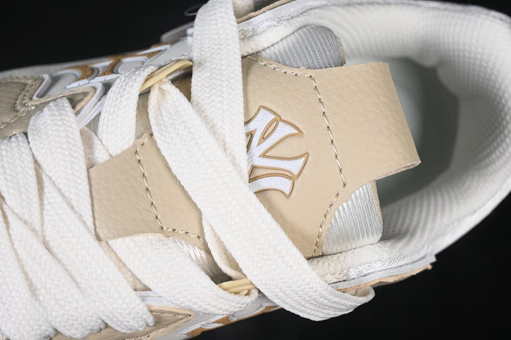 Close-up of the beige tongue and white laces