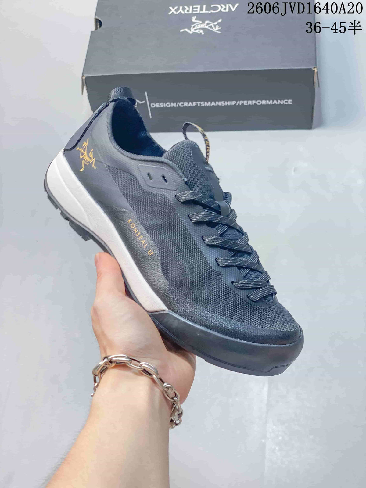 Charcoal gray Arc'teryx Konseal LT shoe with a white section on the midsole.