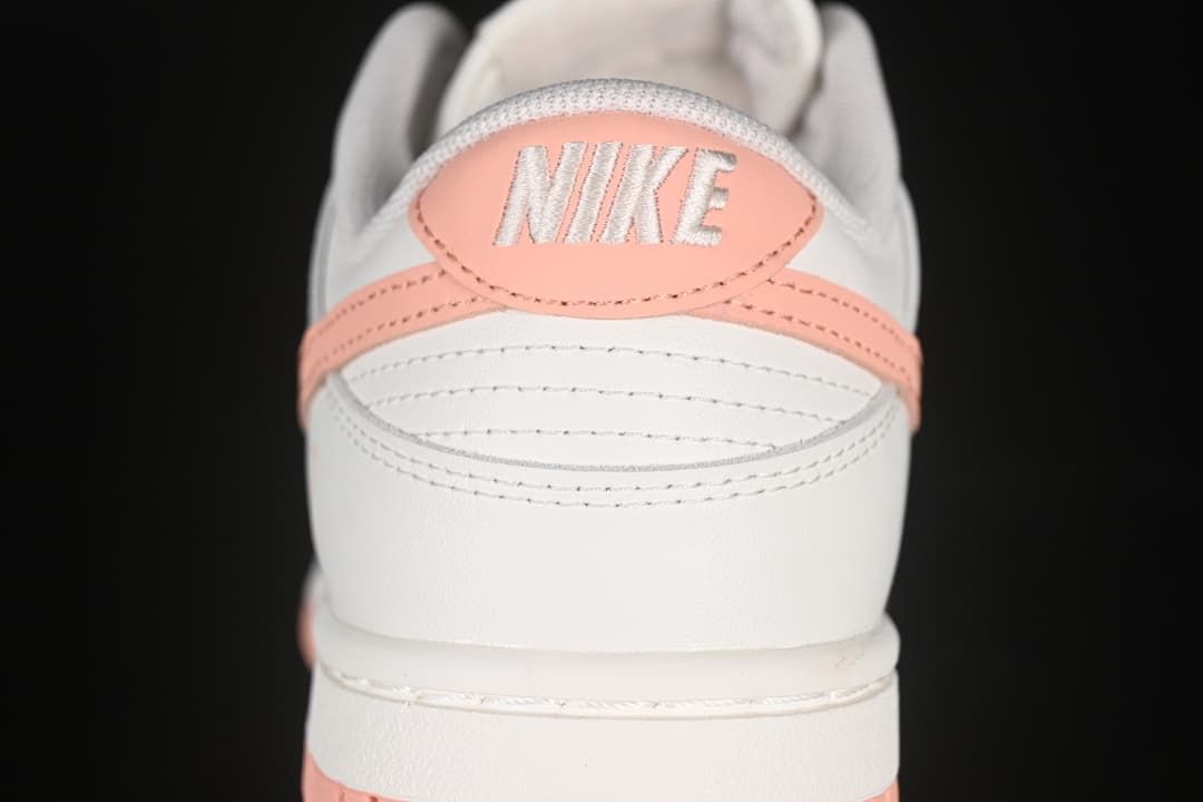 Rear view showing pink heel details and embroidered branding