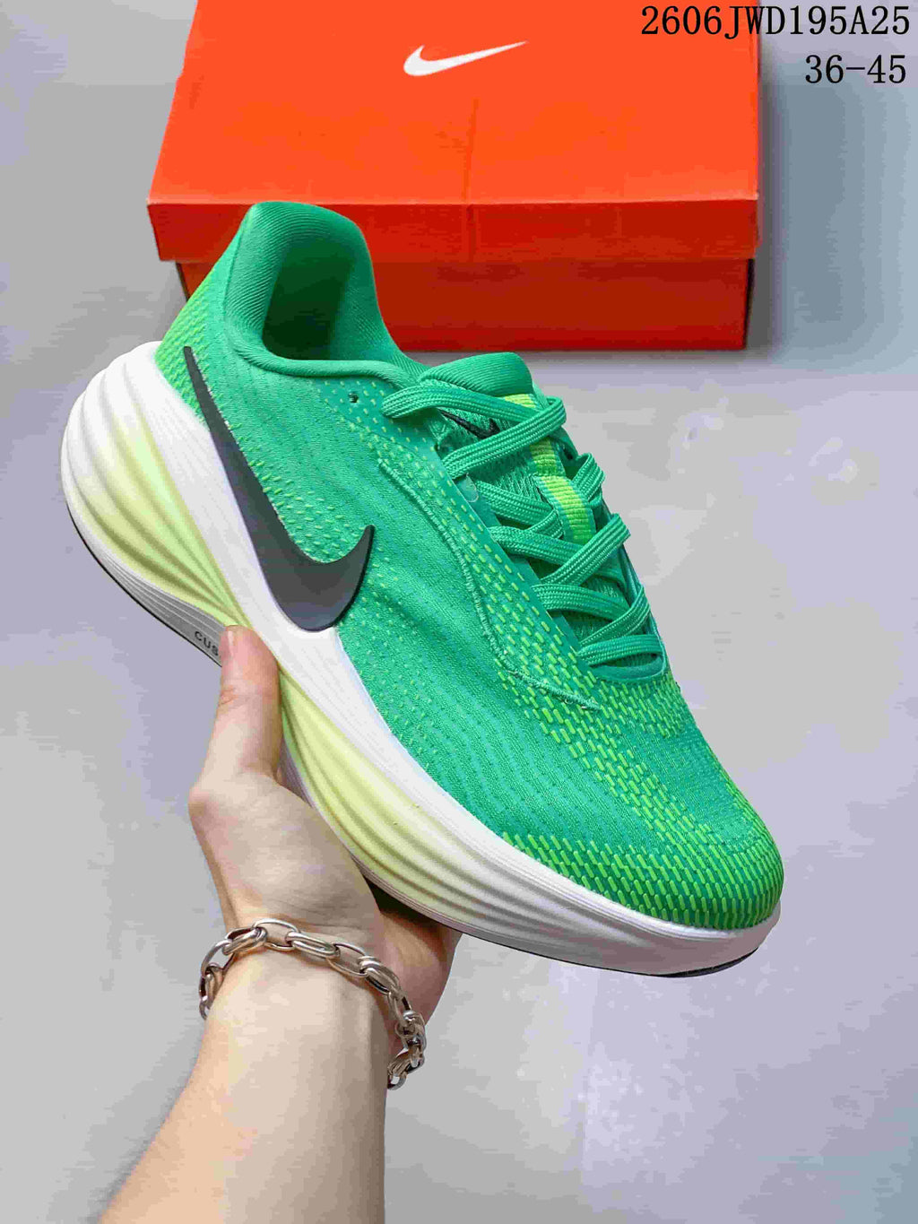 Bright green running shoe with a dark side Swoosh and pale midsole.